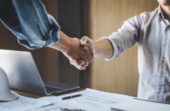 two engineer meeting project handshake after consultation conference project plan